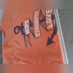 Various sized t shirts with our #adoptionjourney slogan